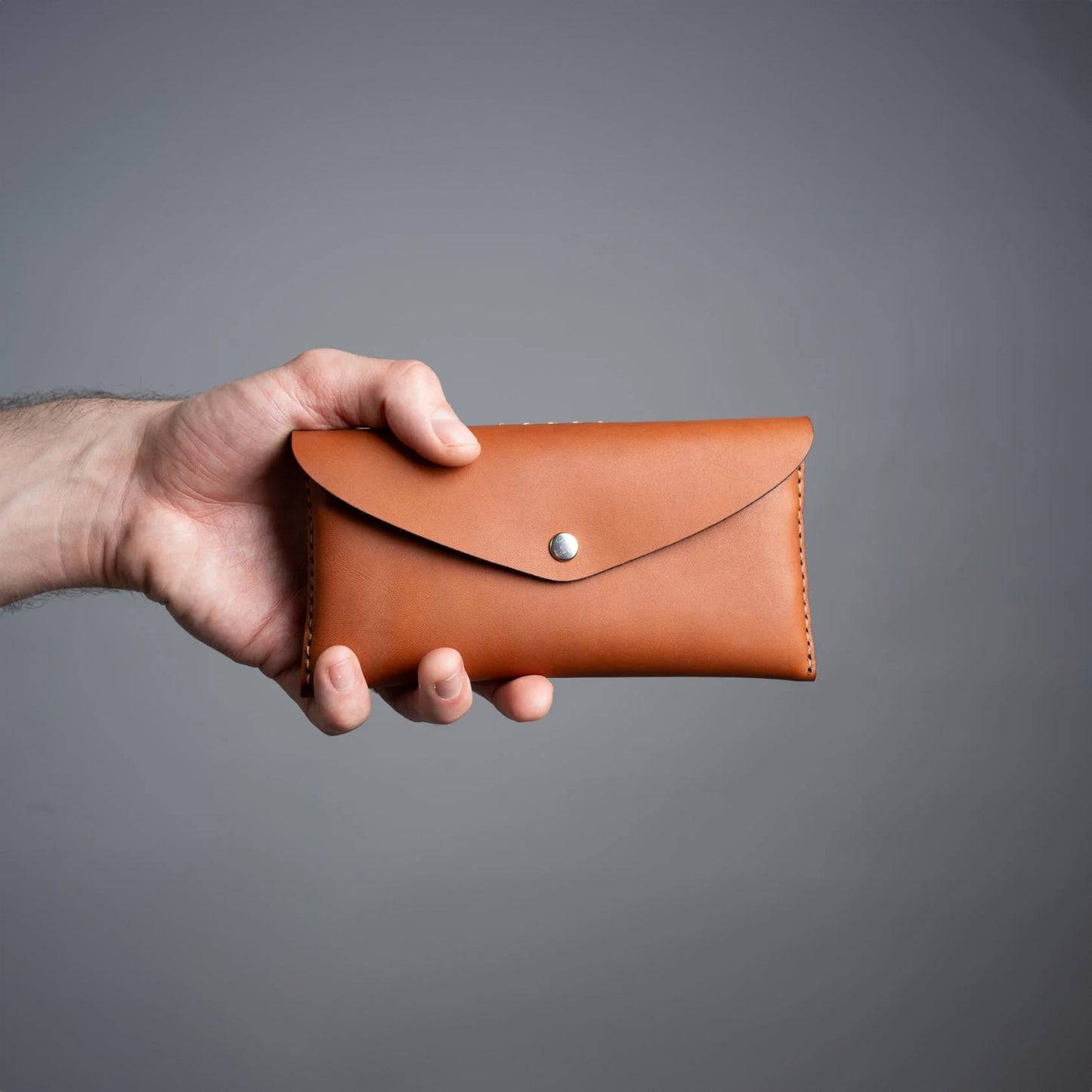 https://cdn.shopify.com/s/files/1/0746/9767/0945/files/leathertoolpouchcognacnewzealand.jpg?v=1717579963
